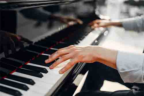playing-piano Two Hands and a Grand Piano
