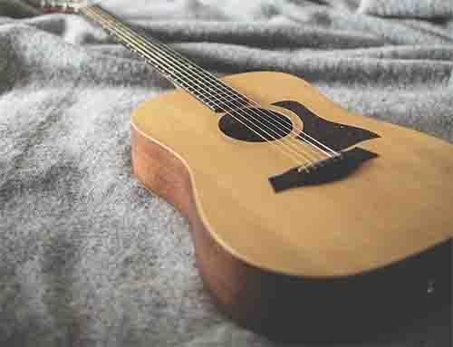 Acoustic Guitar on a Blanket