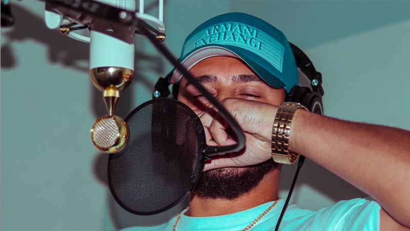 what-to-rap-about Man Rapping In Front of Studio Microphone